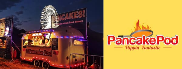 The Pancake Pod trailer lit up at night beside a Ferris wheel, next to the Pancake Pod 'Flippin' Fantastic' logo